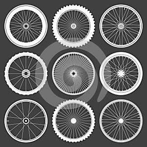 White bicycle wheel symbols collection. Bike rubber tyre silhouettes. Fitness cycle, road and mountain bike. Vector