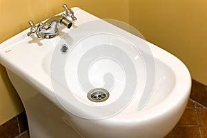 white bidet in a modern toilet room