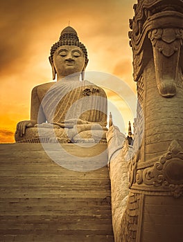 White Big Buddha statue in golden light. Thailand