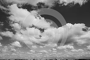 White and big clouds on a dark sky.