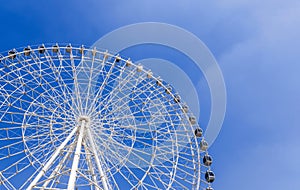 white big Ferris wheel on background a blue sky in amusement park Navryz in Tashkent in Uzbekistan with copy space