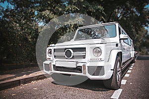 white big jeep limousine on a summer day