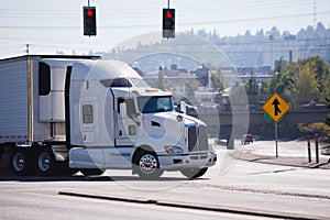 White big rig semi truck with reefer unit on refrigerator semi t photo