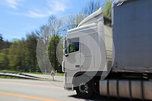 White big truck in motion on highway