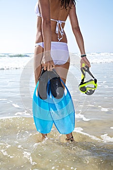 White bikini woman with flippers and goggles