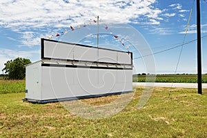 White billboard along a country road in rural Texas