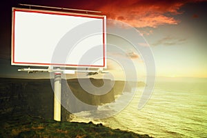 White billboard and cliffs of Moher at sunset