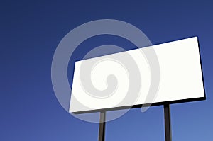 White Billboard with pure blue sky - sun on lower right