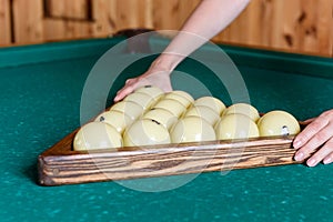 White billiard balls for Russian billiards on a green background