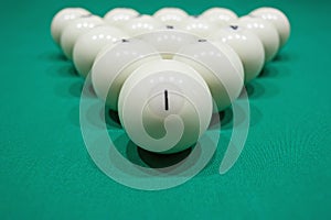 White billiard balls for Russian billiards, in a triangle on the table