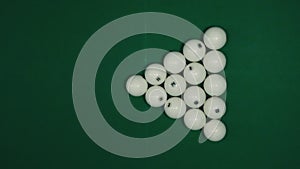 White billiard balls for Russian billiards, a triangle on the table.