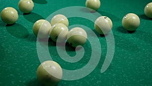 White billiard balls for Russian billiards, a triangle on the table. View from above.