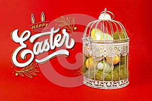 White bird cage with Easter eggs in it on a red background