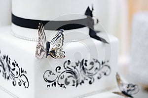 White and black butterfly wedding cake