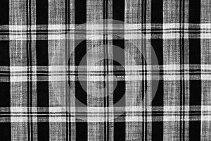 White and black checkered plaid fabric texture for background. tartan texture