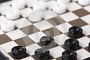 The White and black checkers on the Board