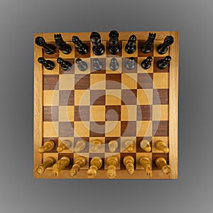 White and black chess pieces placed on a chessboard