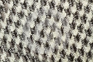 White and black decorates wooven fabric in a close up view