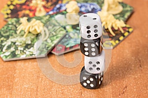 White and black dice on each other