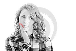 White and black Full isolated picture from young woman with toothache with red spot.