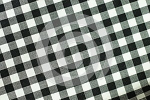 White, black and gray checkered boxes cell. Fabric texture background