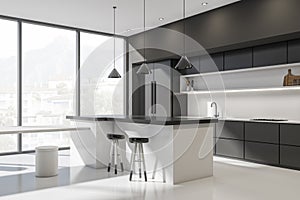 White and black kitchen set interior with dining table and chairs, window