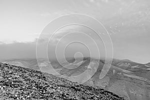 White and black landscape view on mystic blue morning desert sunrise