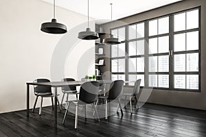 White and black living room with chairs and table near window on black floor