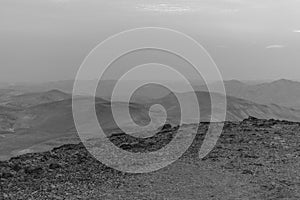 White and black mystic blue morning landscape view on negev judean desert in Israel