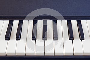 White and black piano keys, close-up background