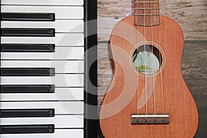 White black piano keys and guitar with a strings