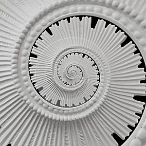 White black stucco moulding plasterwork spiral abstract fractal pattern background. Plaster abstract spiral effect background. Spi photo