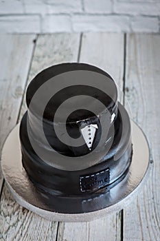 White and black tuxedo wedding or birthday cake