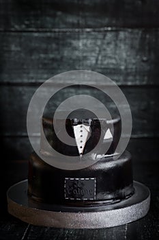 White and black tuxedo wedding or birthday cake