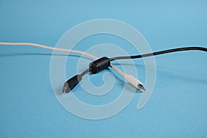 White and black wires with different usb interfaces on a blue background.