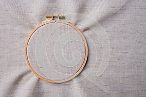 White blank canvas on wooden round frame as a background. Flat lay top view