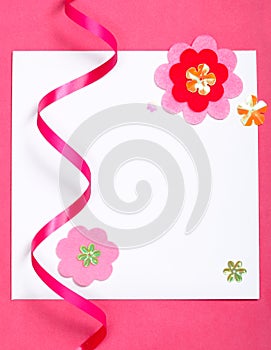 White blank card on pink paper