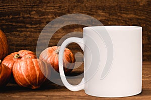 White blank coffee mug Autumnal theme mock up.