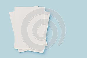 White blank cover magazine stack, mockup on blue background