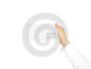White blank envelope mock up holding in hand. Empty post documen