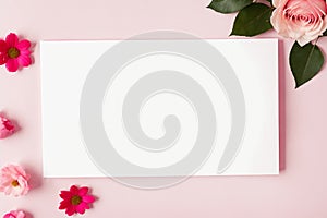 White blank greeting card on a pink background with flowers, love letter