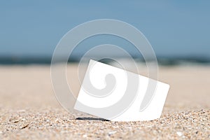 White Blank Instant Photo Card On Beach Sand