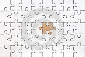 White blank jigsaw puzzle with last piece solve pattern texture for graphics design template