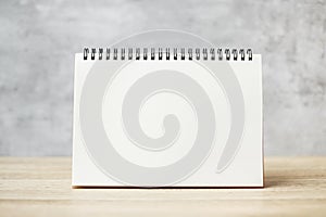 White blank paper notebook or Calendar on wooden table with Copy space for your text, template and mock up concept