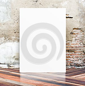 White Blank Poster in crack cement wall and diagonal wooden floor room,Template Mock up for your content,Business presentation