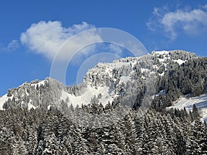White blanket on alpine peak Gulmen or Gulme 1789 m in the Swiss Alps and above the Lake Walen or Lake Walenstadt / Walensee