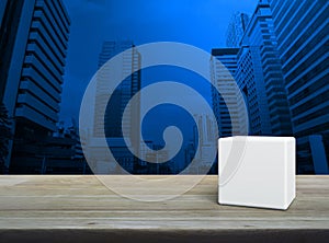 White block cube on wooden table