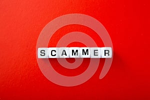 White block with scammer word photo