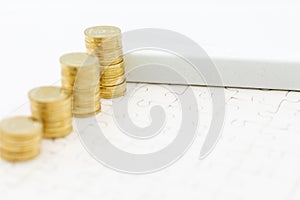 White block and stack of golden coins, it can write for various occasions. Image use for business background concept