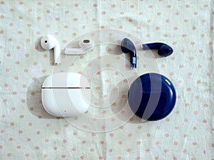 White and Blue AirPod On Table